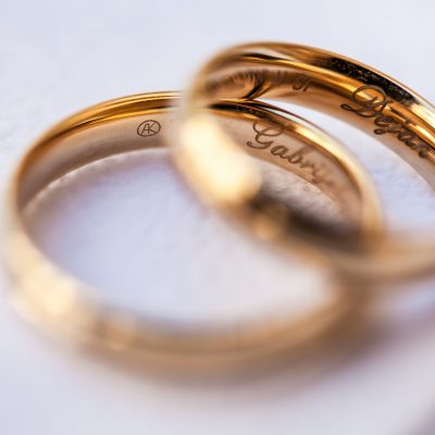 The couple's two wedding rings consist their name inside.