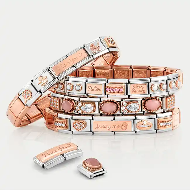 4 nomination bracelets in rose gold. One separate nomination charm and one link.