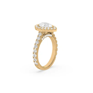 The side view of Jose's yellow gold pear-shaped lab-grown diamond ring. At this angle you can see the secret halo of pave stones under the main setting.