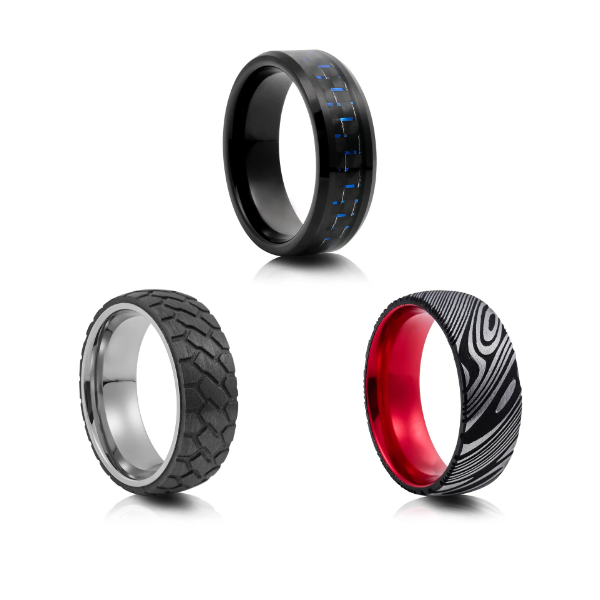 Three unique mens wedding bands by Jose Jewellers featuring a black carbon fibre ring, a textured tungsten carbide band, and a Damascus steel ring with a red interior.